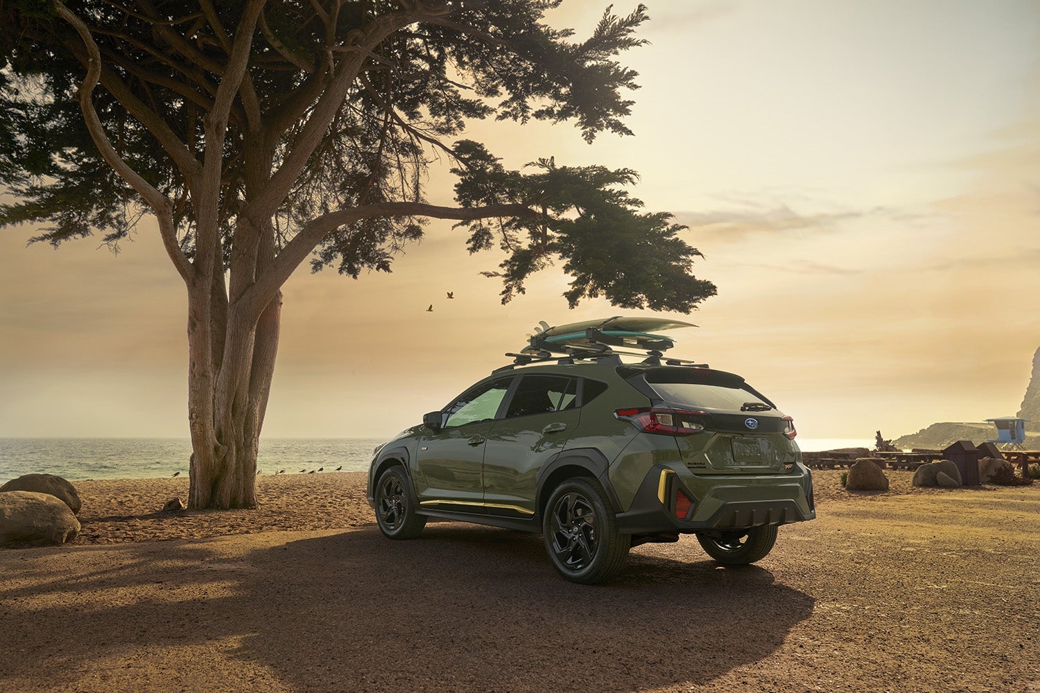 Crosstrek with mountains in the distance near Riverton