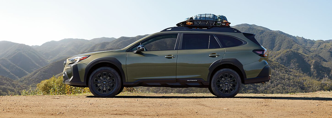 Subaru Outback driving snowy canyon