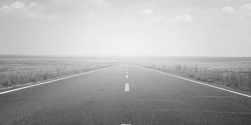 Empty open road stretching to the horizon