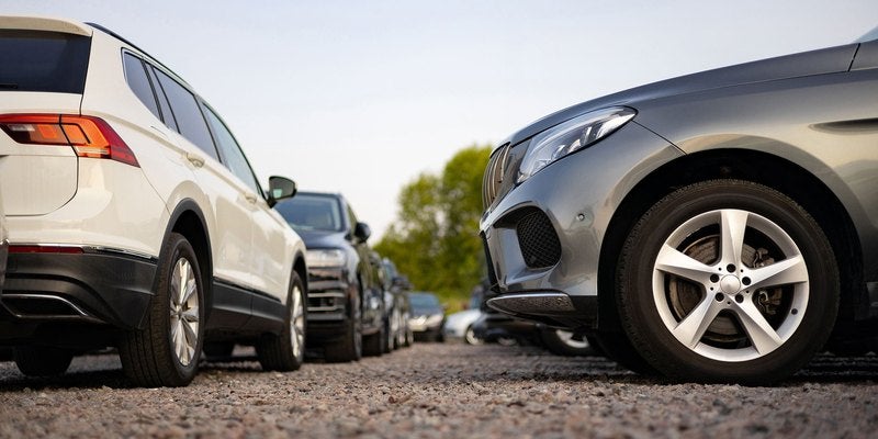 Two vehicles parked side by side on a dealership lot