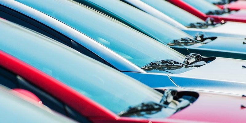 Row of parked vehicles on a dealership lot