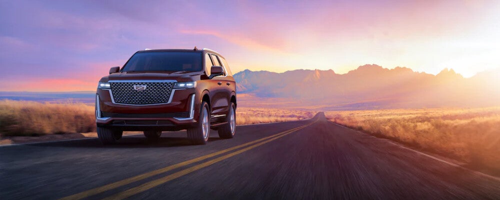 2023 Cadillac Escalade Driving on Highway at Sunset