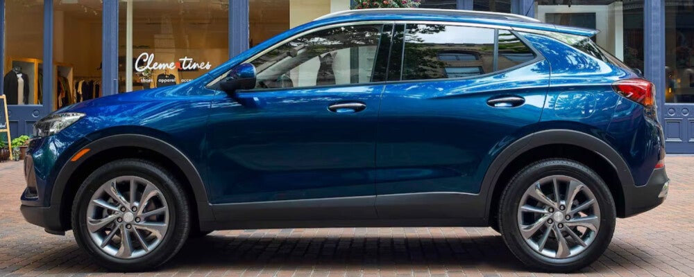 a 2023 Buick Encore GX parked on the street in a shopping mall