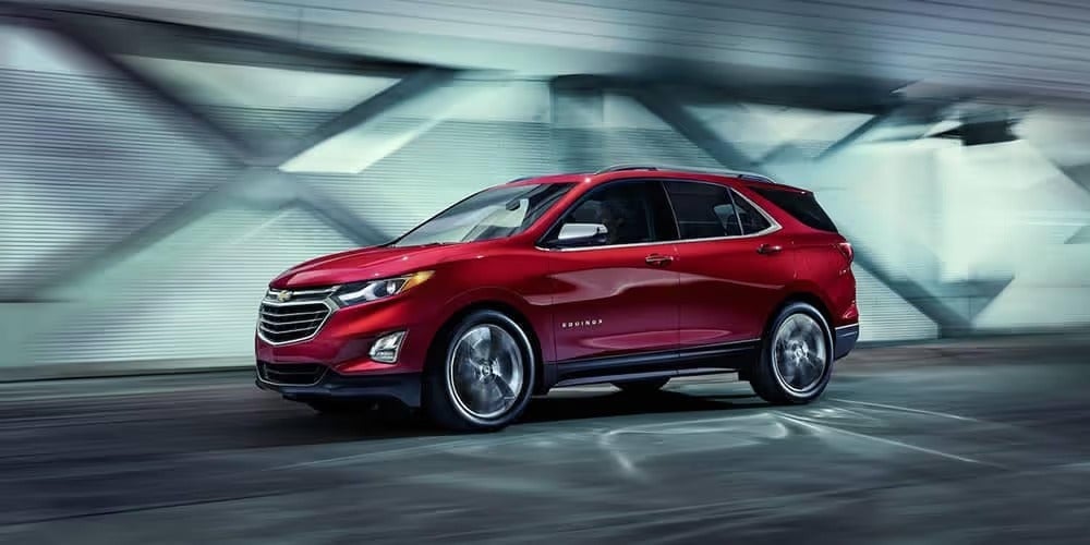 Rear side view of Chevrolet Equinox driving