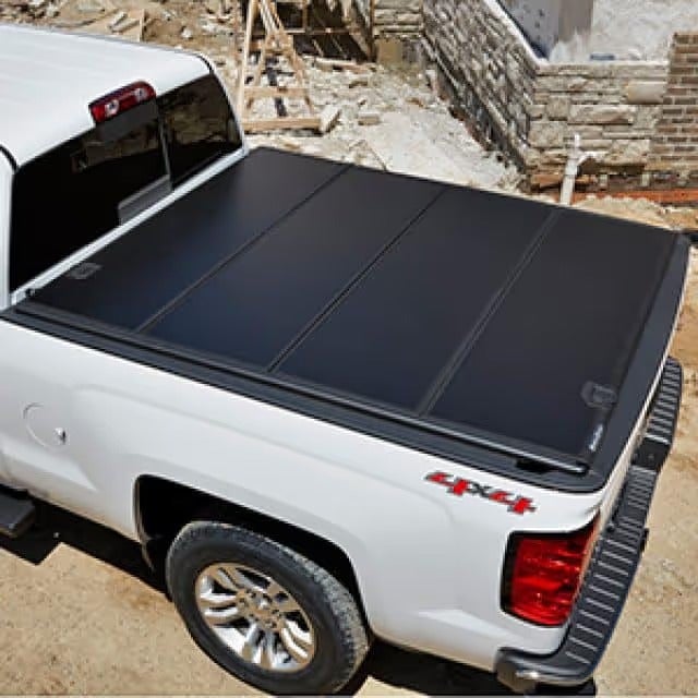 Pickup truck bed with folding tonneau cover installed
