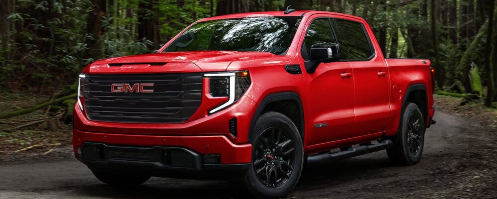 2024 GMC Sierra 1500 driving through the woods