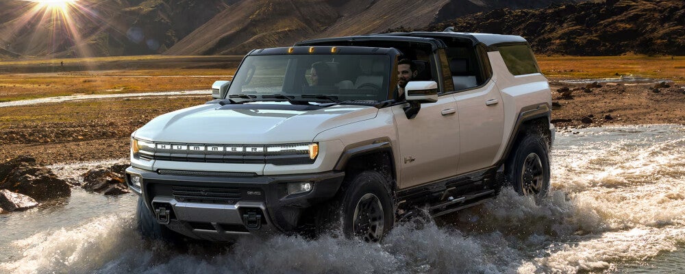 2024 GMC Hummer EV SUV driving through water