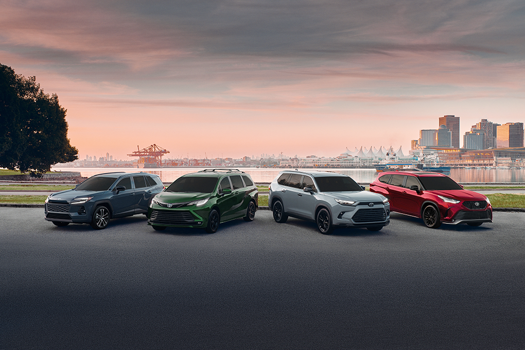 Four Toyota SUVs by waterfront skyline