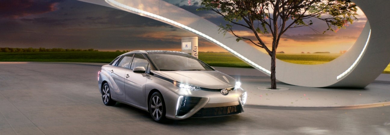 2017 Toyota Mirai parked below an architectural piece