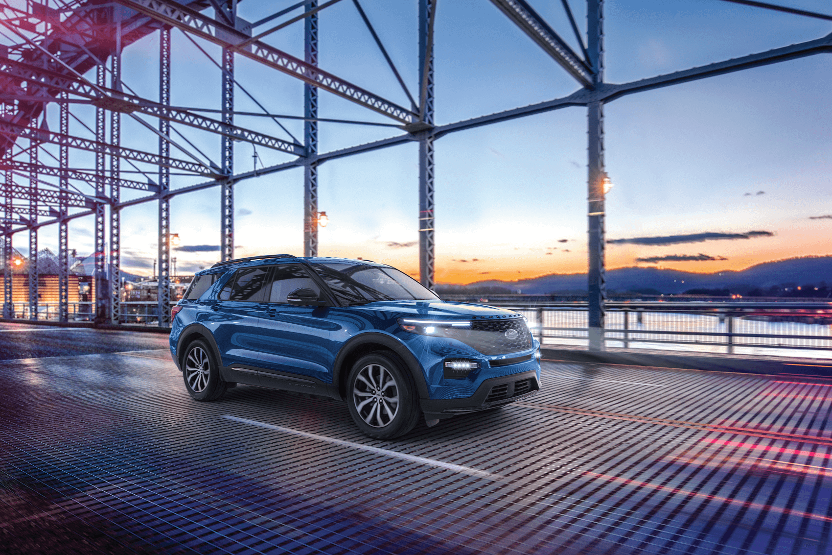 Ford Explorer crossing a bridge at sunset