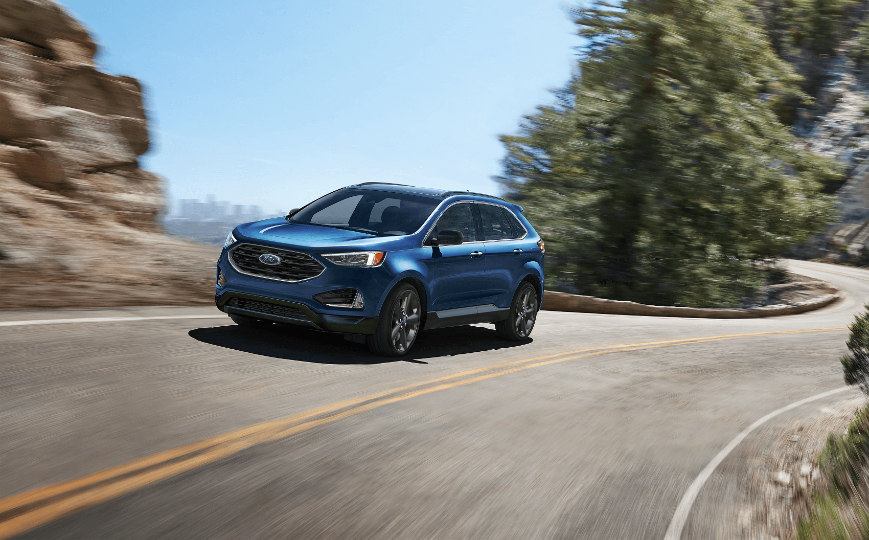 Ford Edge driving up a winding road