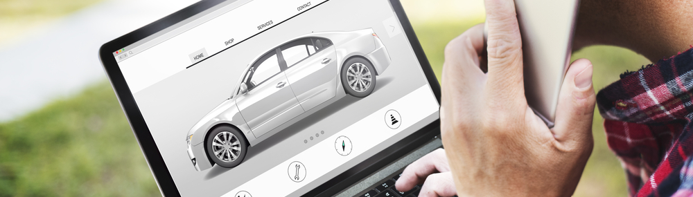 Man completing car application on laptop