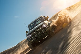 Ford Bronco Driving Down a Sand Dune