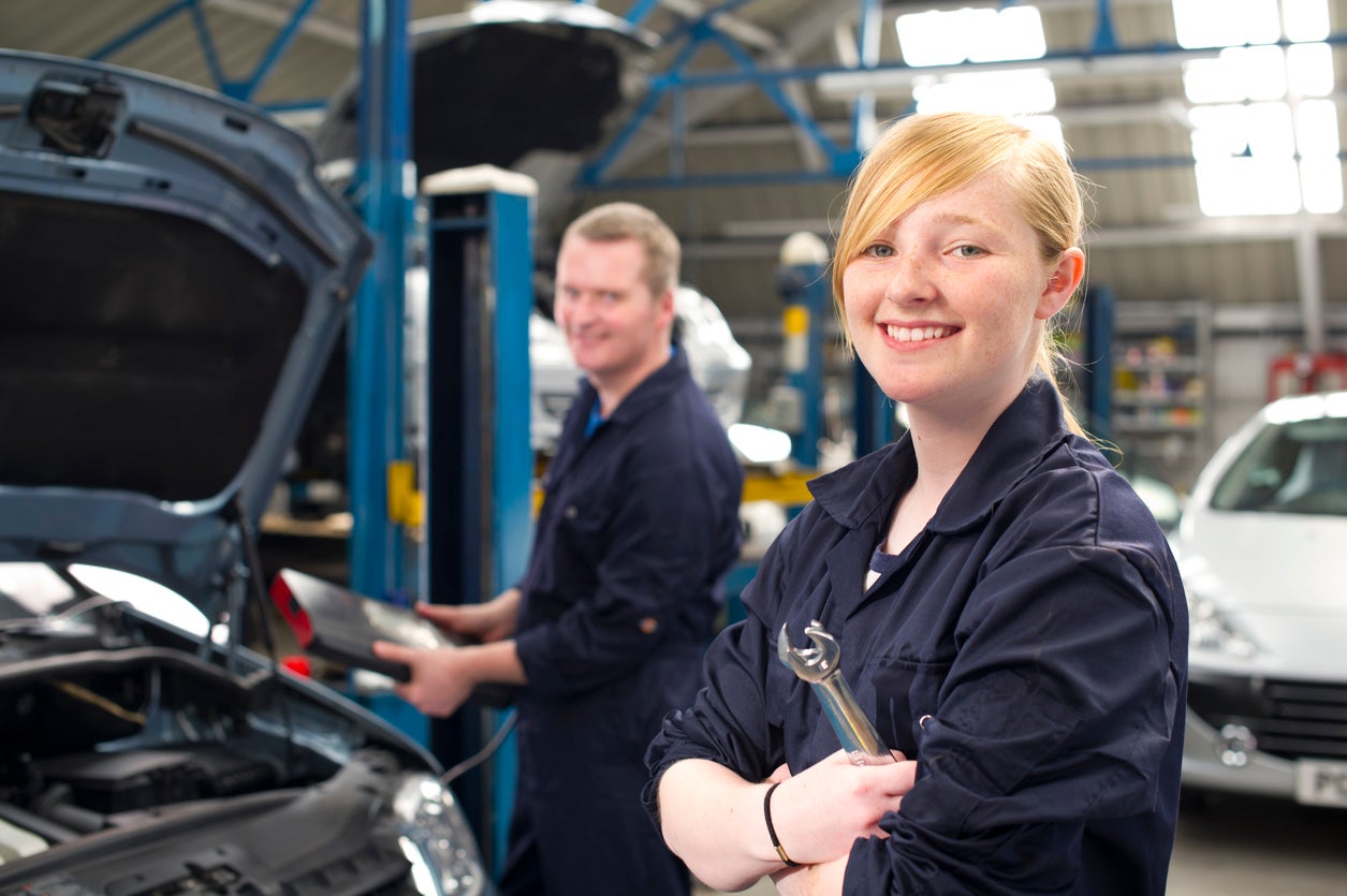 teenager working at the garage