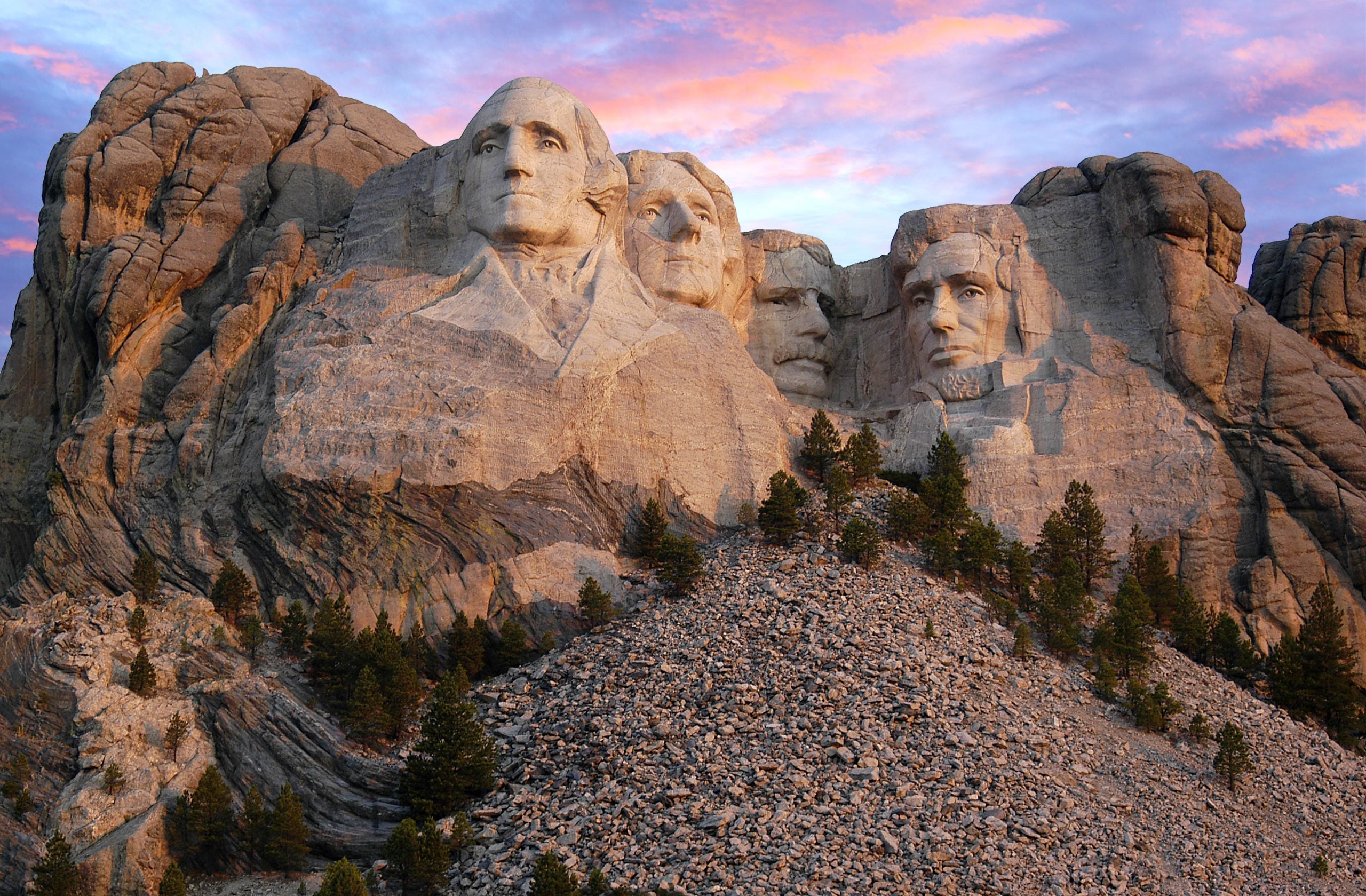 Mount Rushmore morning as the sun begins to light up the mountain range.