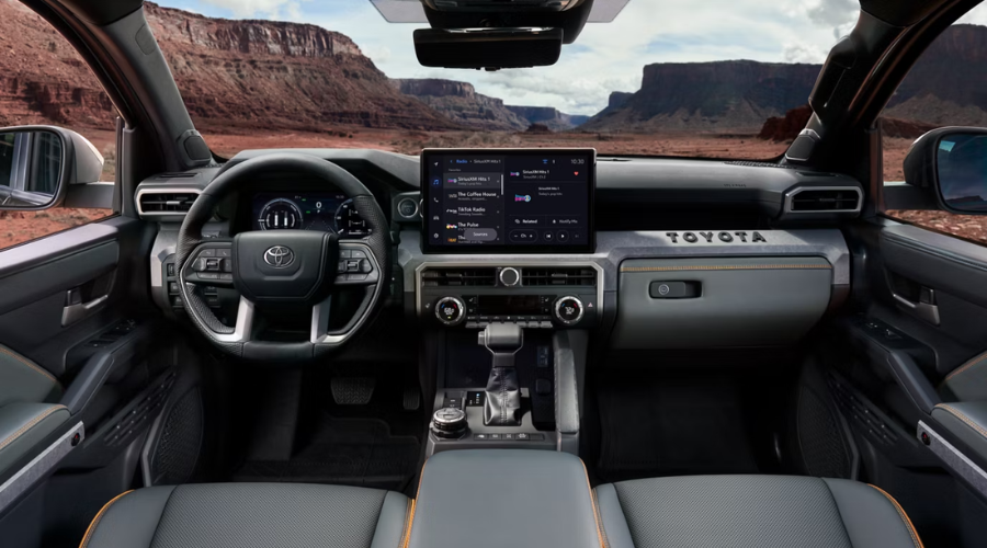 Interior center console of a 2026 Toyota Tacoma in Waukegan showing the tactile drive mode selector knob