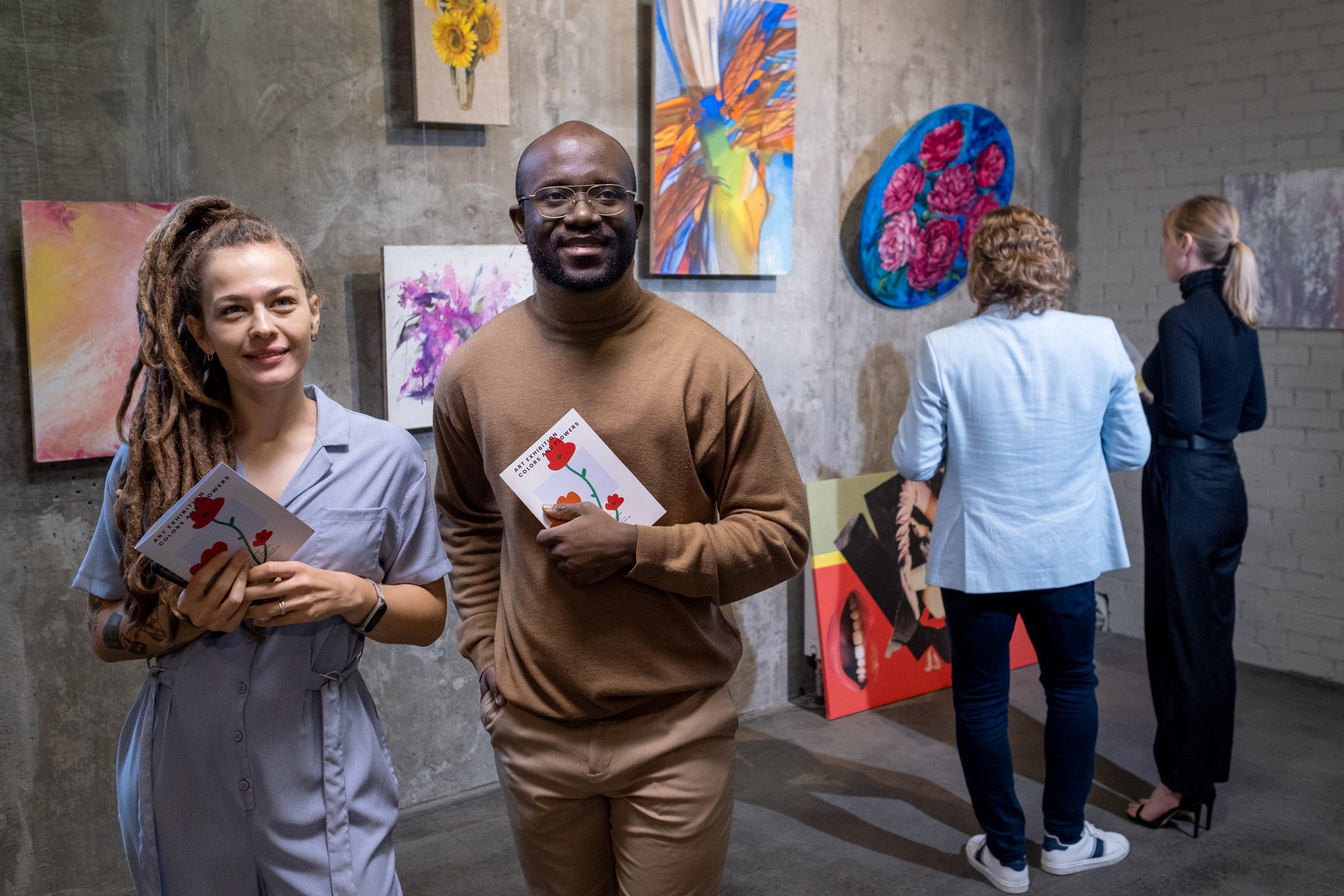 Young couple visiting exhibition in gallery