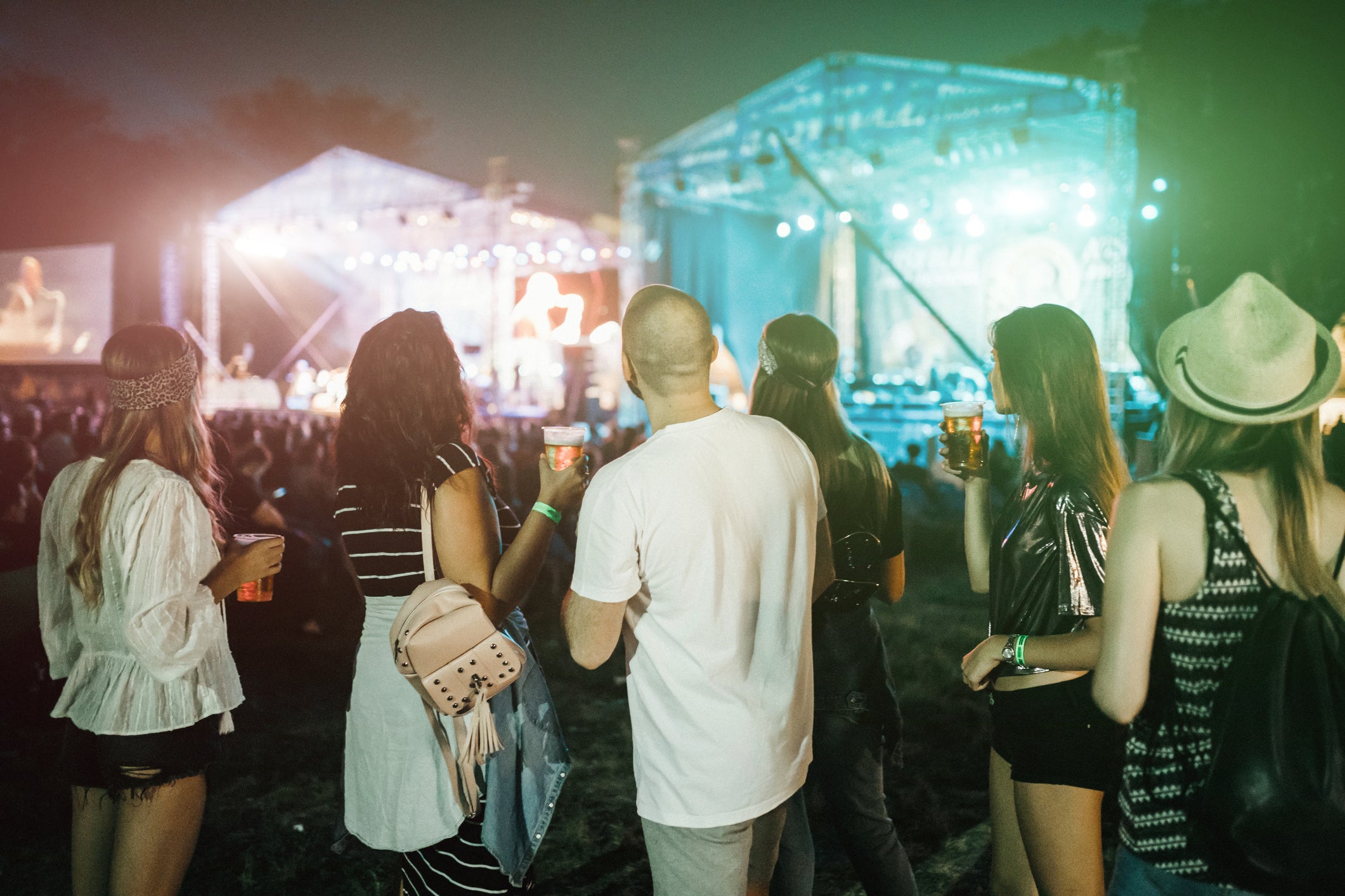 Happy people enjoying music during a music festival