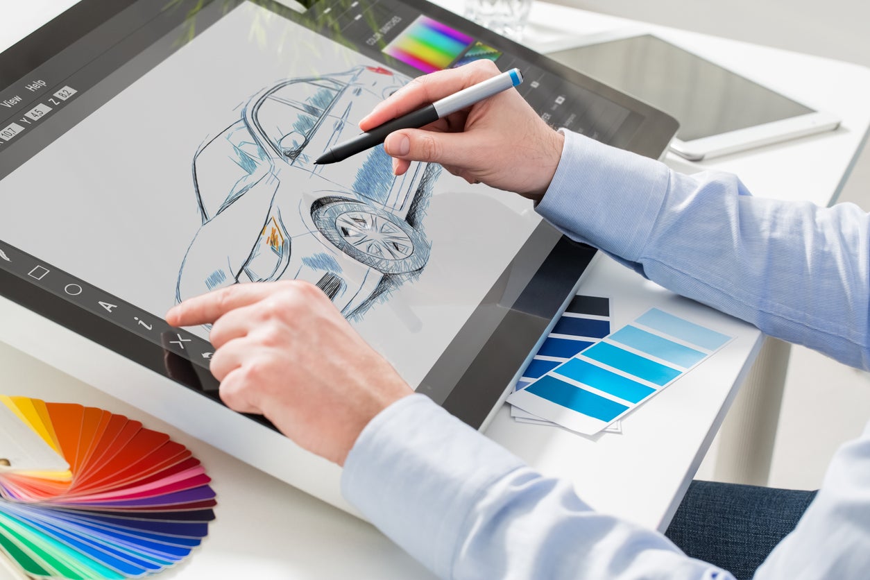 Graphic designer at work. Color samples.