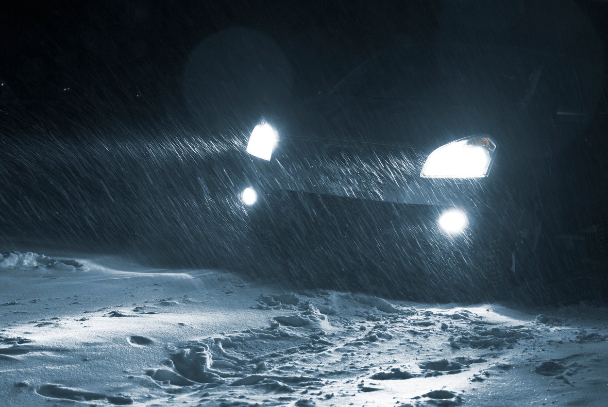 Car driving in a Snowstorm