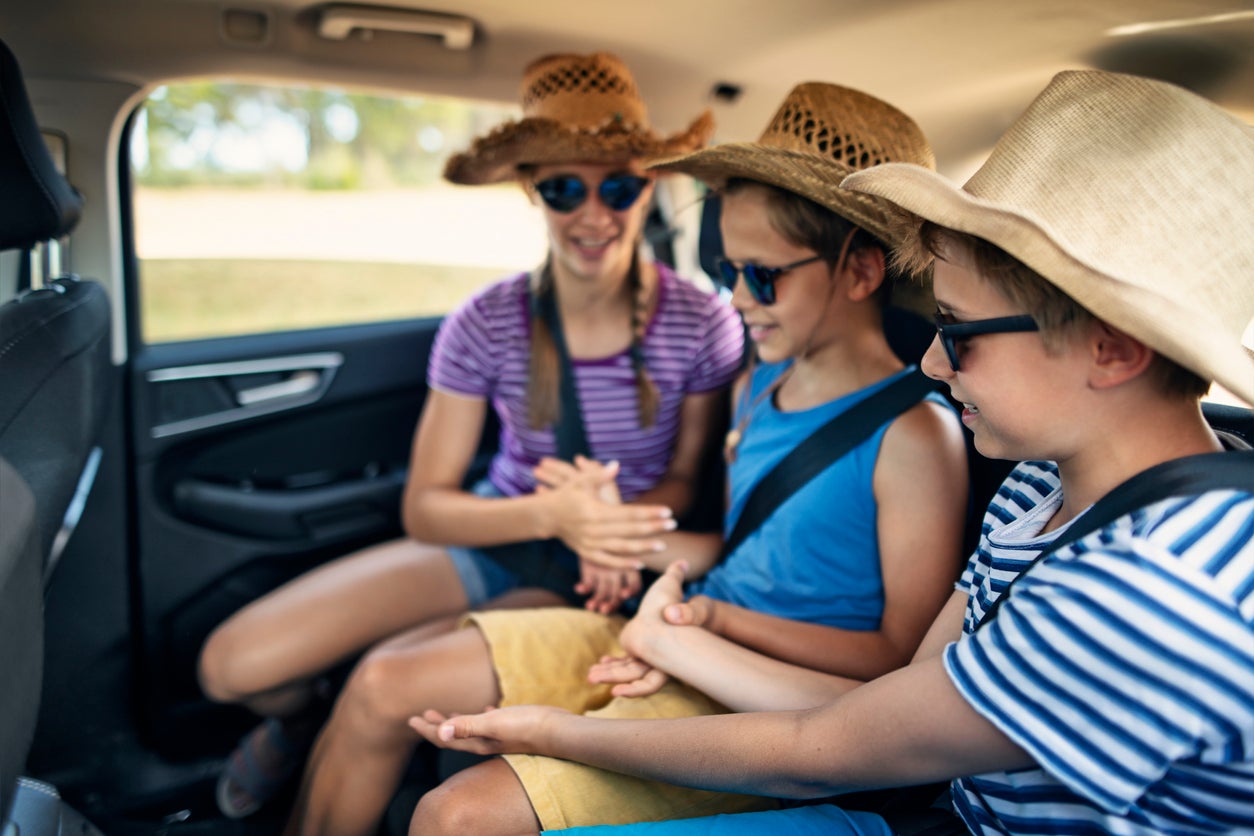 Kids playing games while travelling by car