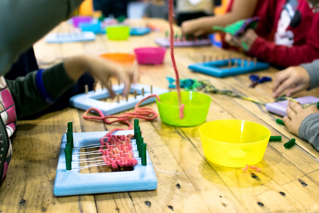 Educational weaving and knitting activity.