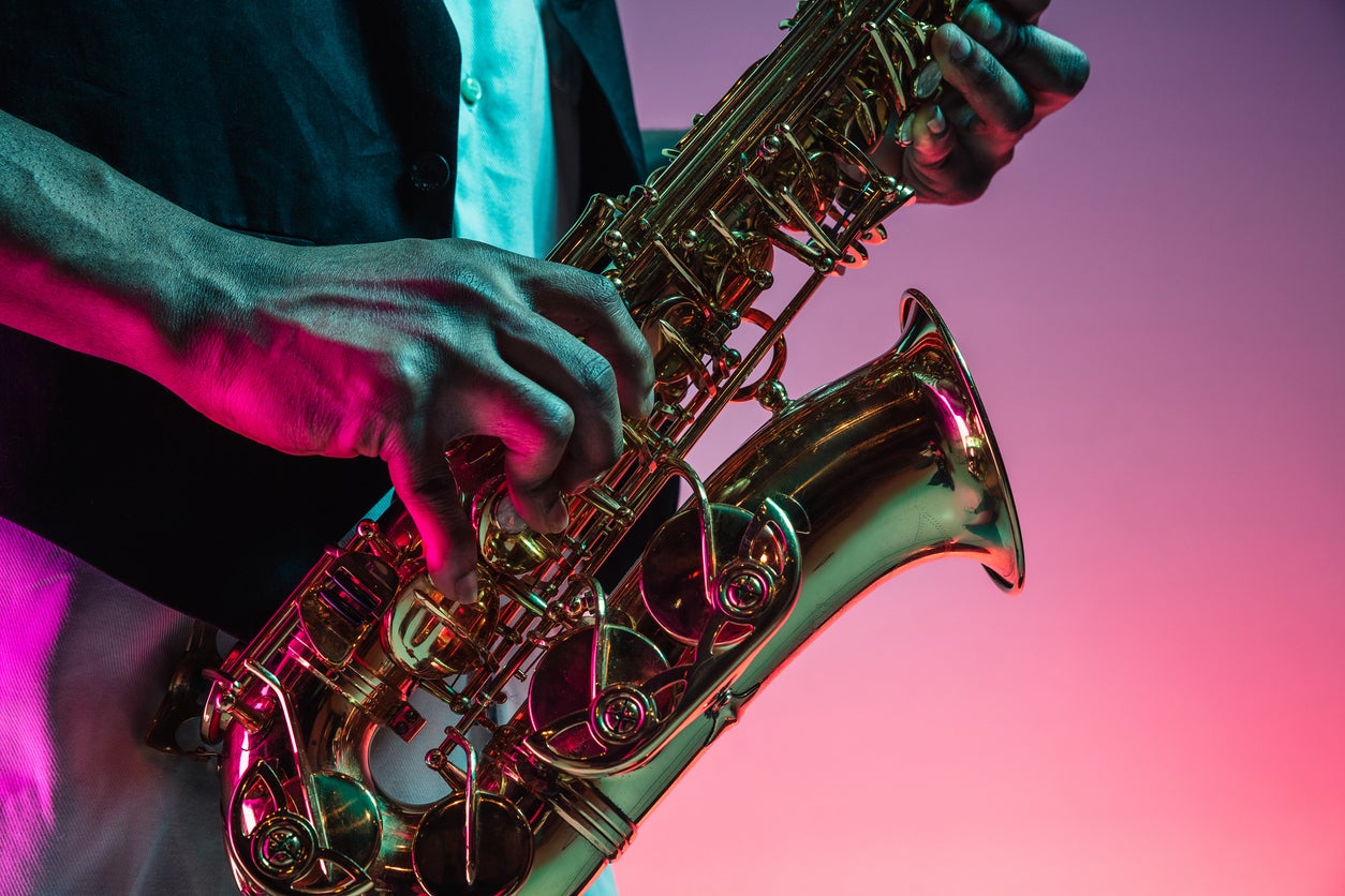 African American jazz musician playing the saxophone.