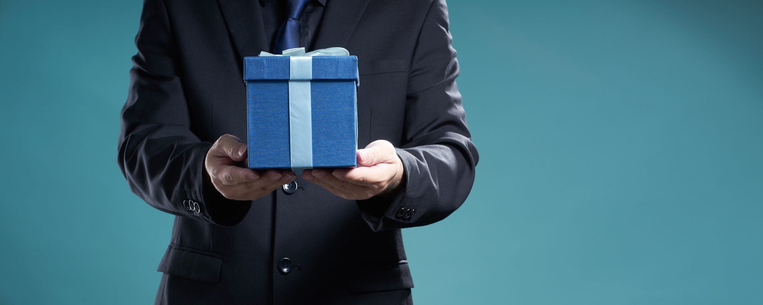 Businessman hold the present box