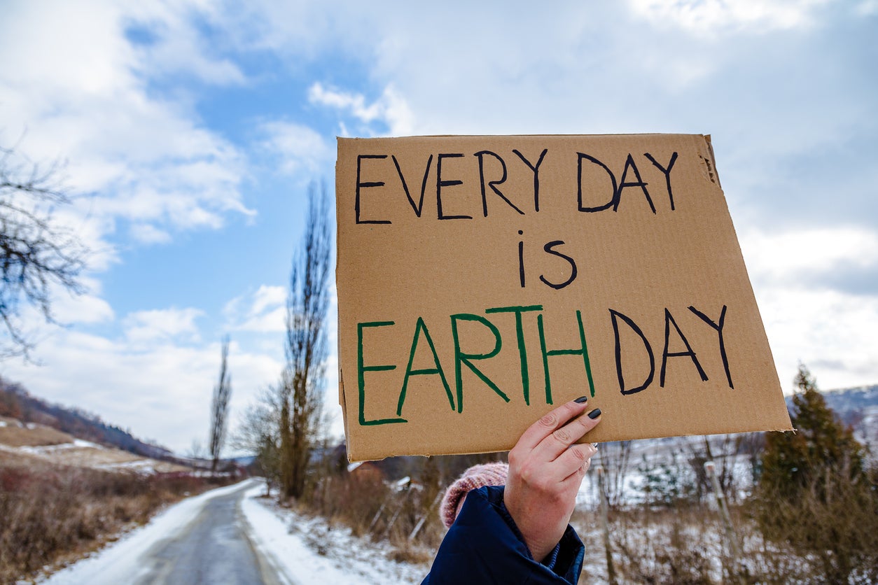 Activist holding sign protesting against climate change
