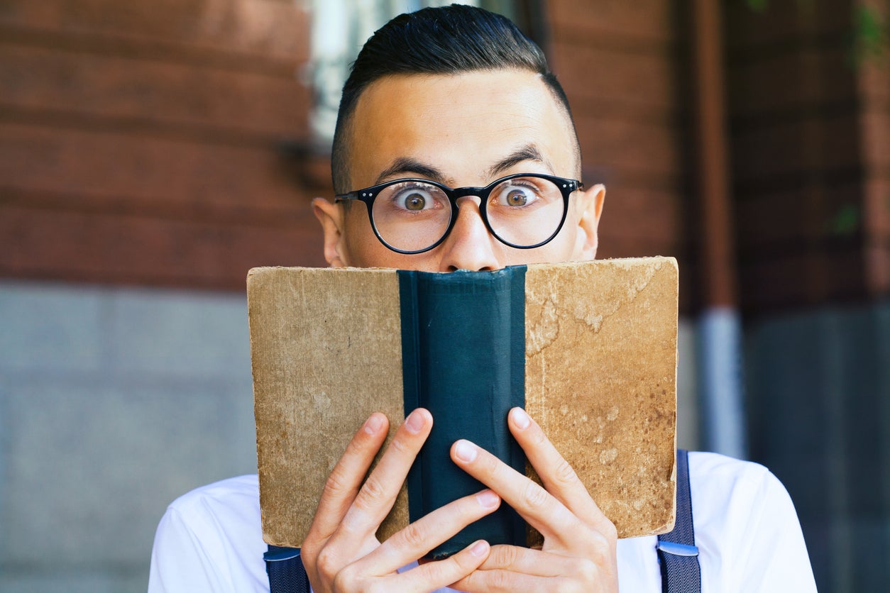 Young man reading a book