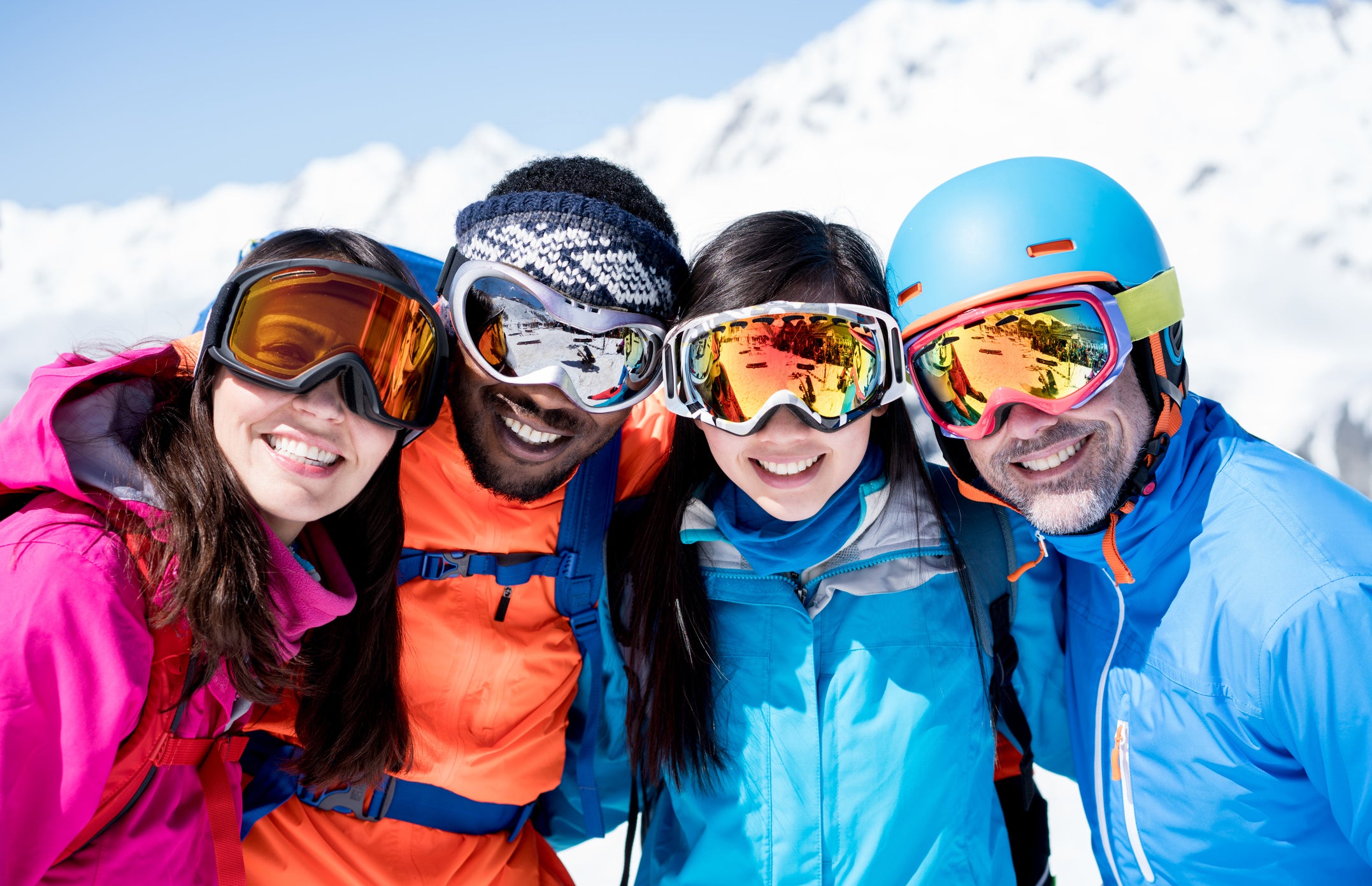 Happy group of friends skiing