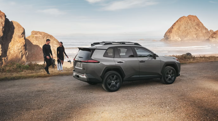 Side profile view of a 2026 Toyota RAV4 in Zion highlighting its athletic squared-off stance and wheel well protective cladding