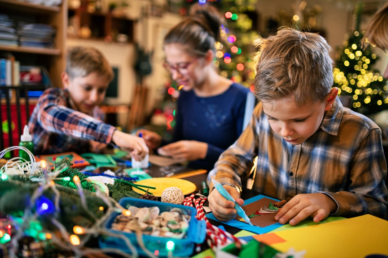 Family crafting Christmas cards
