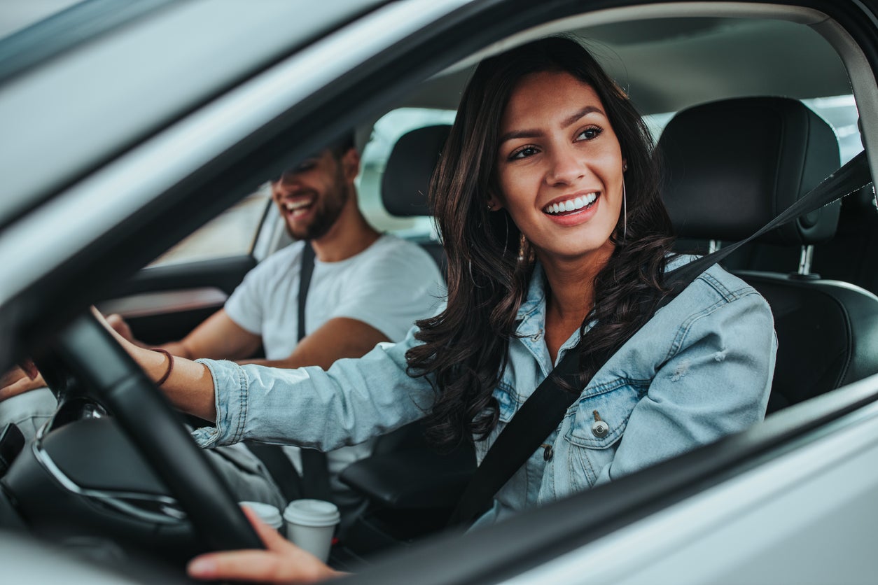 Young couple traveling by car
