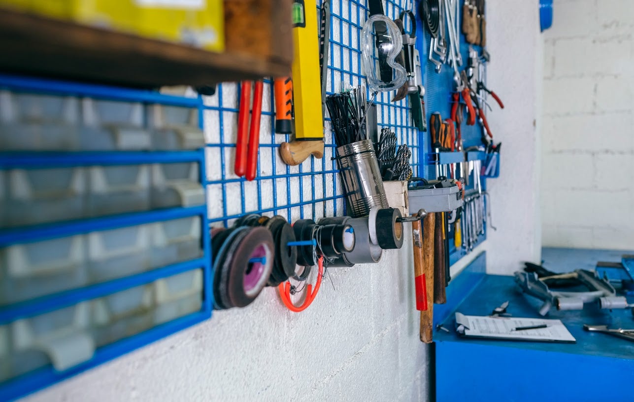 Detail of motorcycle workshop tools board and work bench