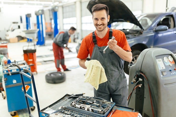 Car mechanic fixing a car