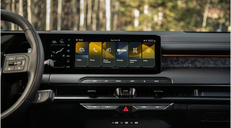 Center dashboard view of the 2026 Kia Telluride infotainment system highlighting the dedicated Trailer setup icon, digital temperature readouts, and USB-C charging ports, designed for effortless trailering setup near Gurnee IL and Classic Kia.