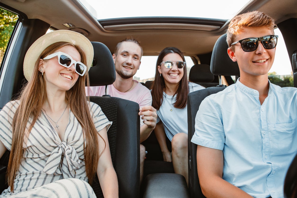 group of friends in car. road trip concept. summer vacation