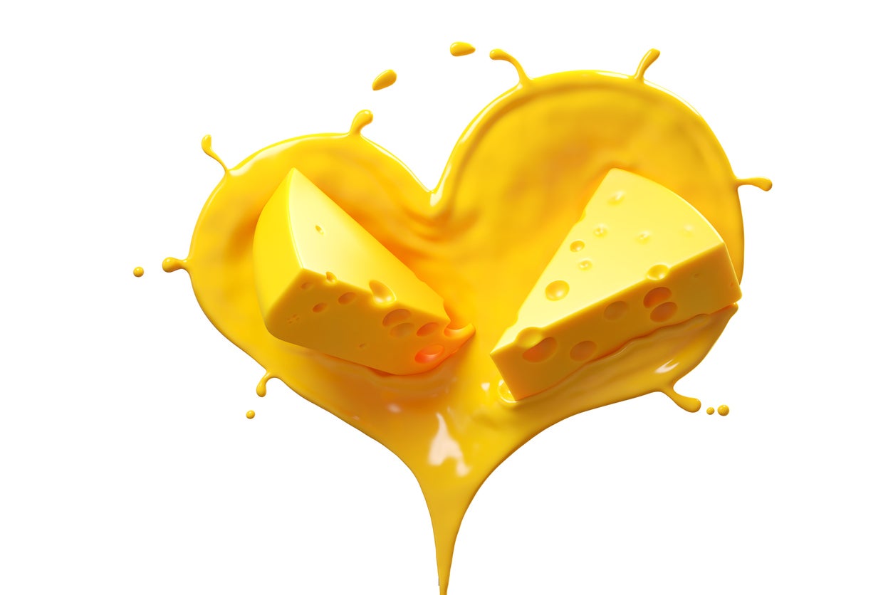 Cheese sauce splashing in the Heart Shape