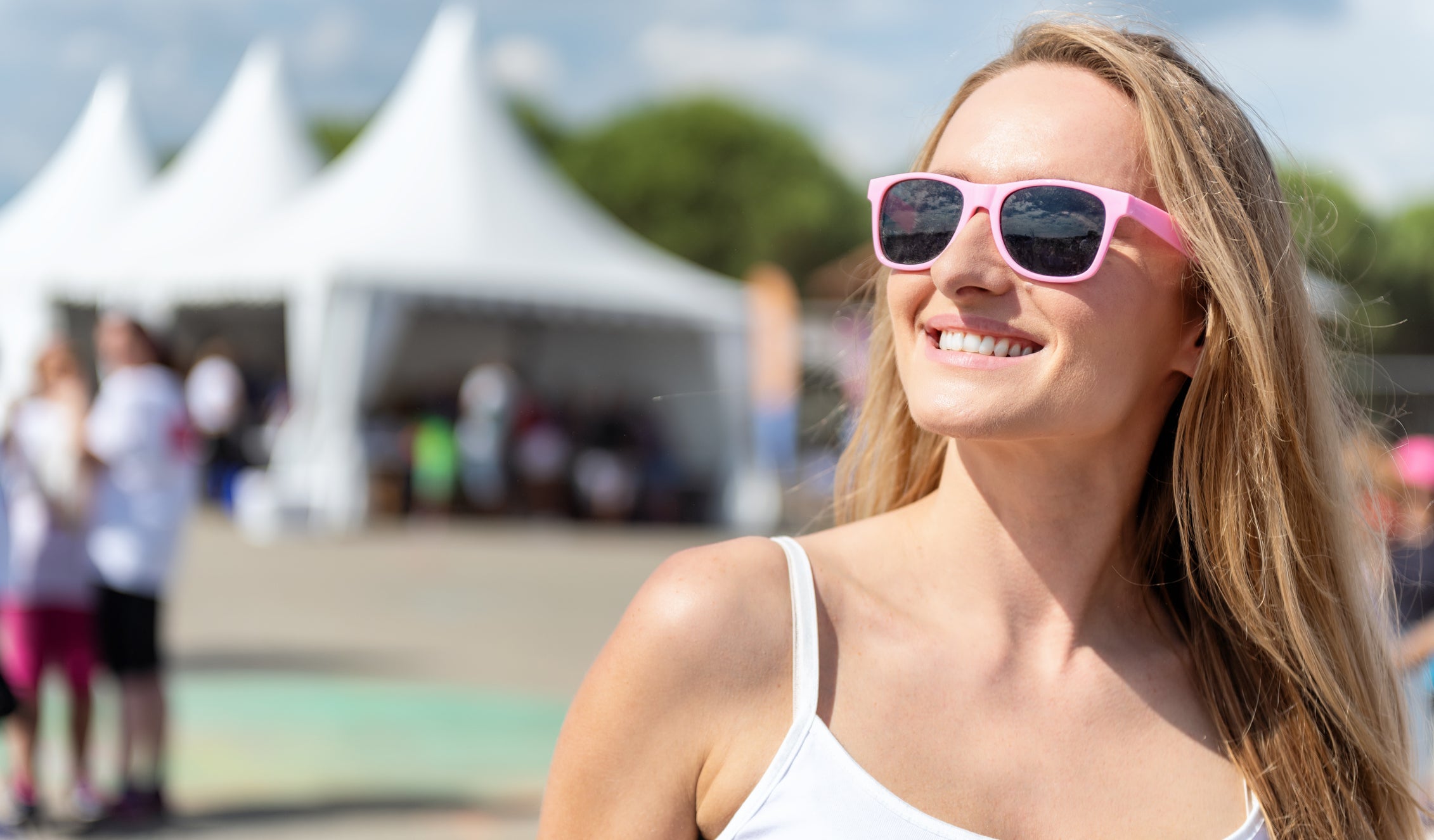 Cheerful woman smiling at festival