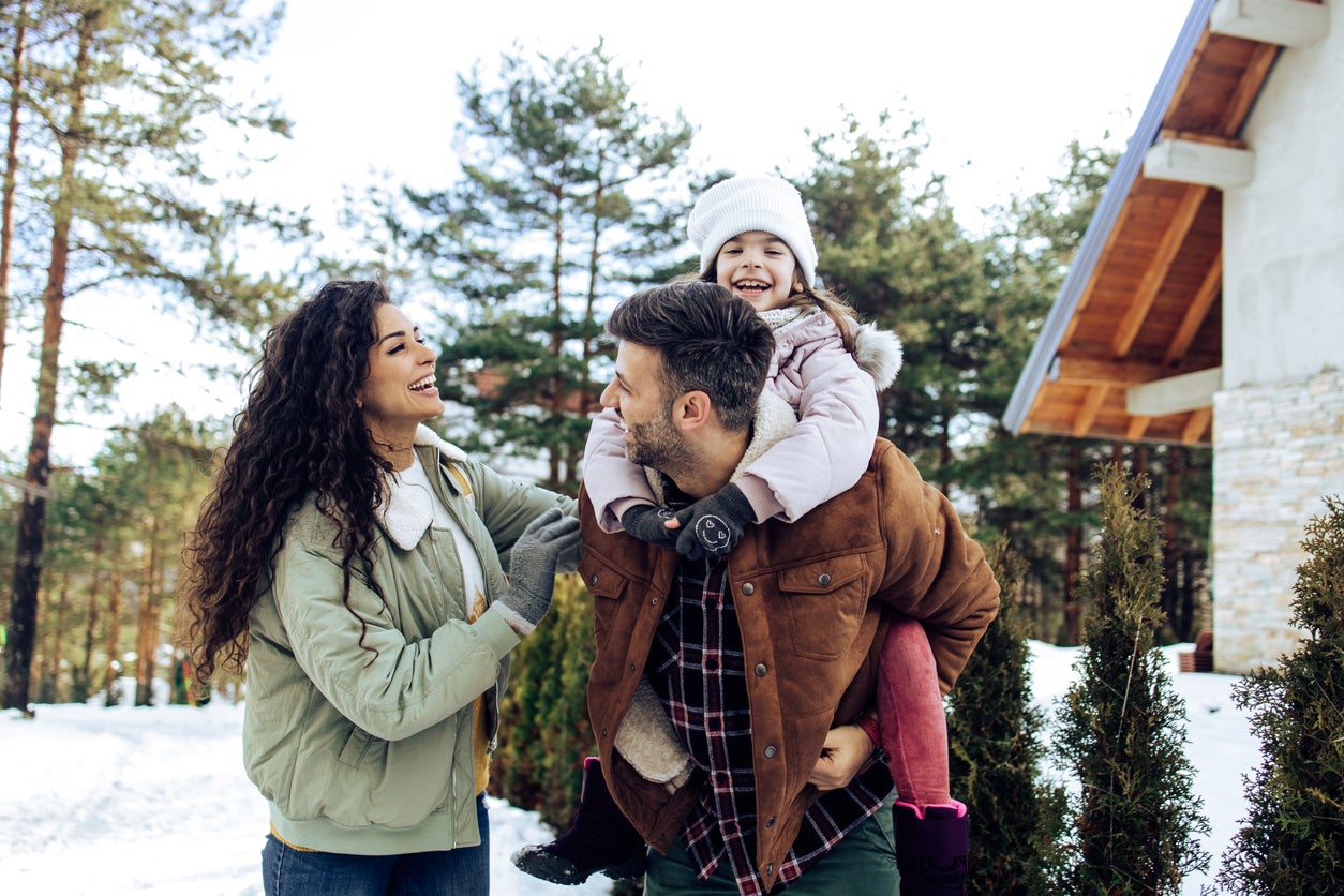 Happy family having fun during their winter vacation