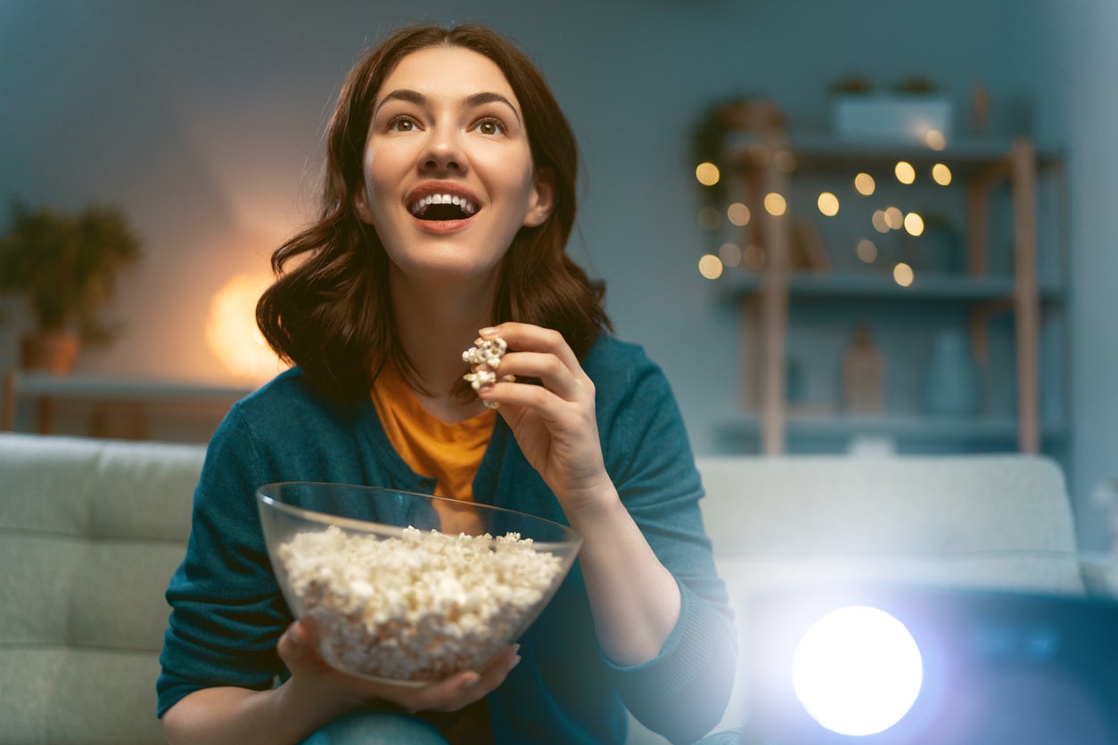 woman watching projector