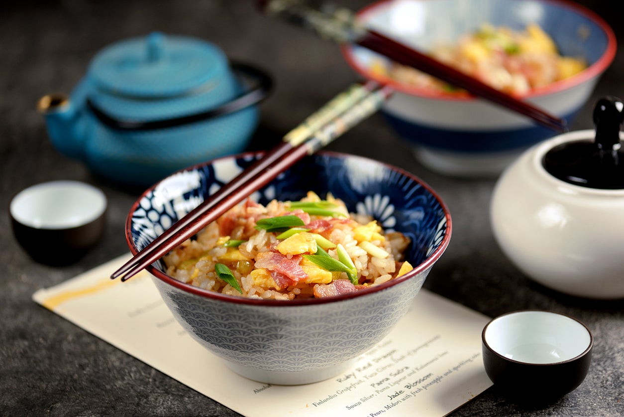 Asian fried rice with bacon and egg.