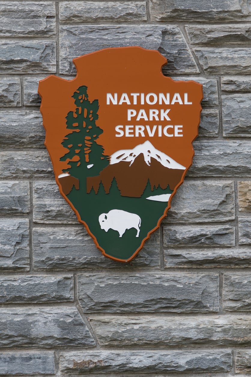 National Park Service Sign on Stone Wall Vertical