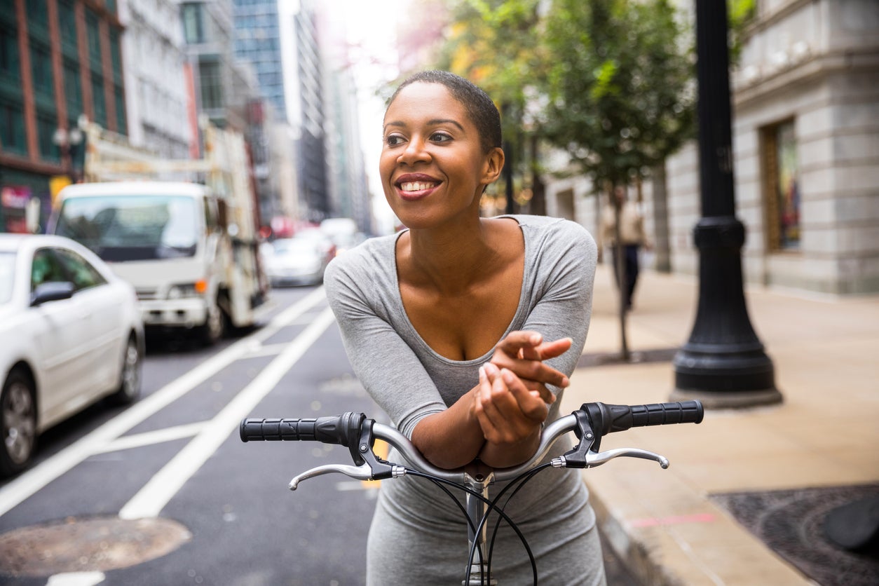 Woman cycling - commuter in downtown Chicago