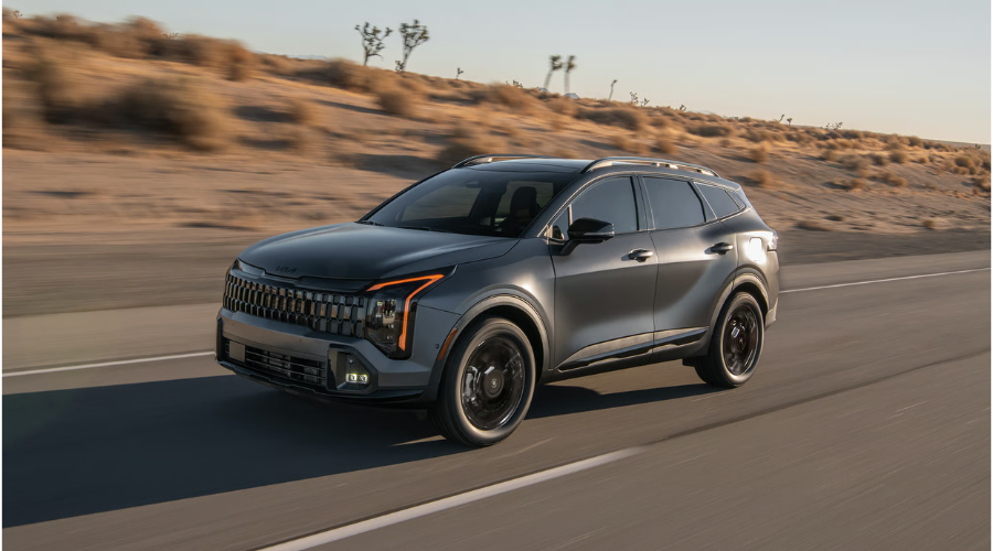A 2026 Kia Sportage PHEV accelerating smoothly down an open Illinois highway displaying its aerodynamic profile Classic Kia in Waukegan, IL