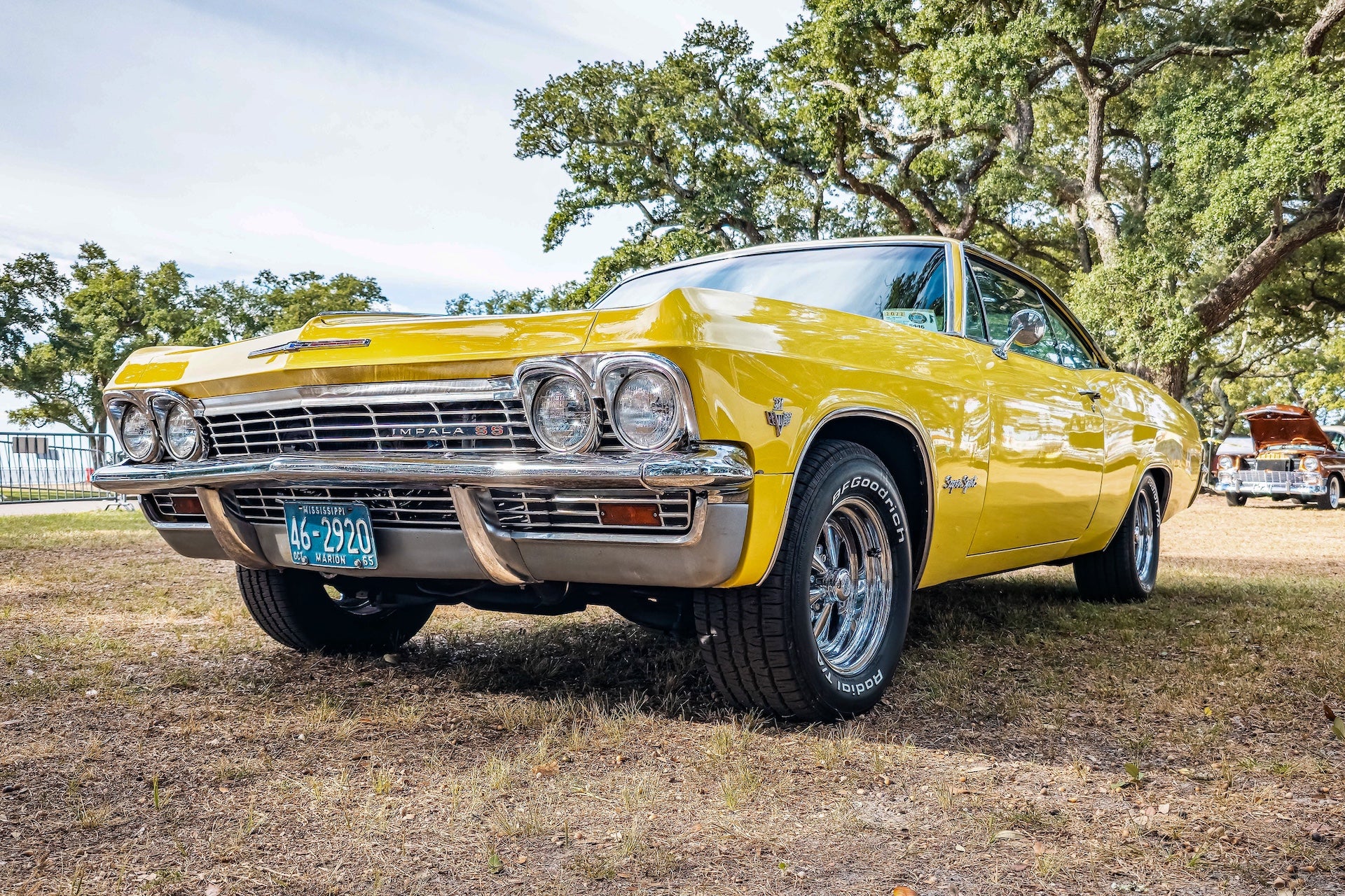 Low perspective front corner view of a 1965 Chevrolet Impala SS Hardtop Coupe at a local car show.