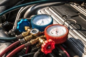 Under the hood showing the AC of a car.