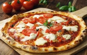 Closeup of Margherita Pizza on a pan.