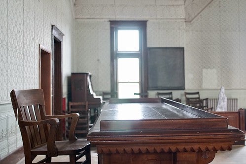 Older style wood desk and chair in a 19th century home
